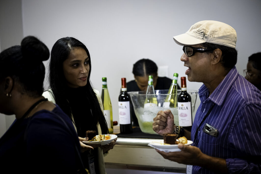 Attendees network during cocktails at Sip and Speak