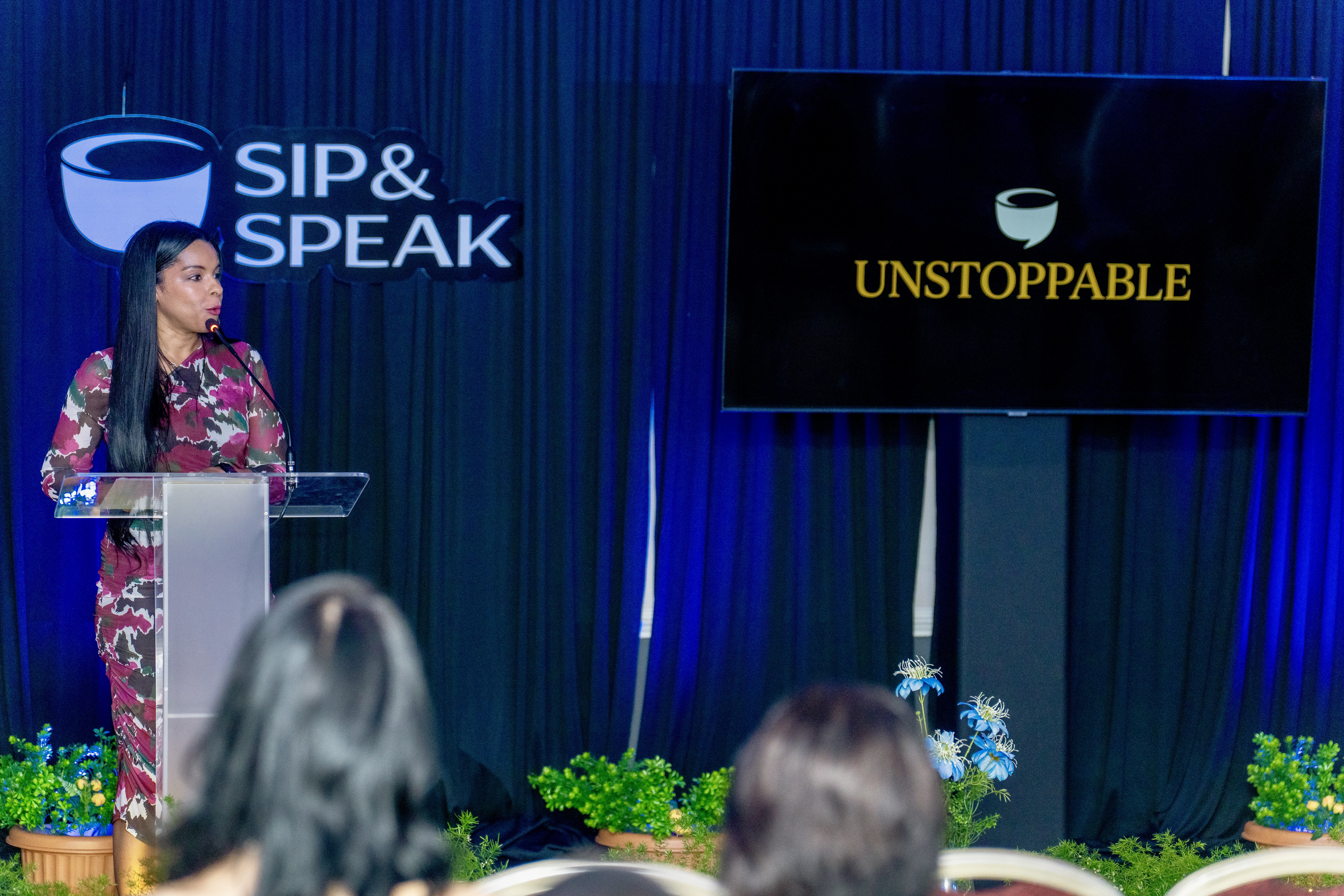 Samantha J. Best delivering the keynote with UNSTOPPABLE on screen
