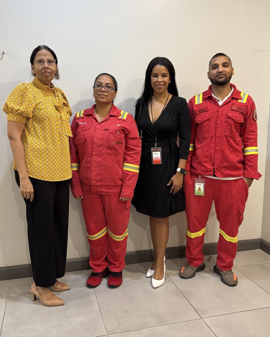 Samantha J. Best with CGCL plant personnel in protective coveralls